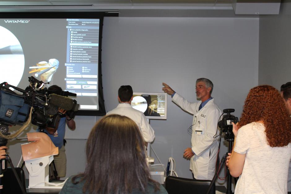 Dr. Michael Daubs demonstrates the virtual surgery simulator
